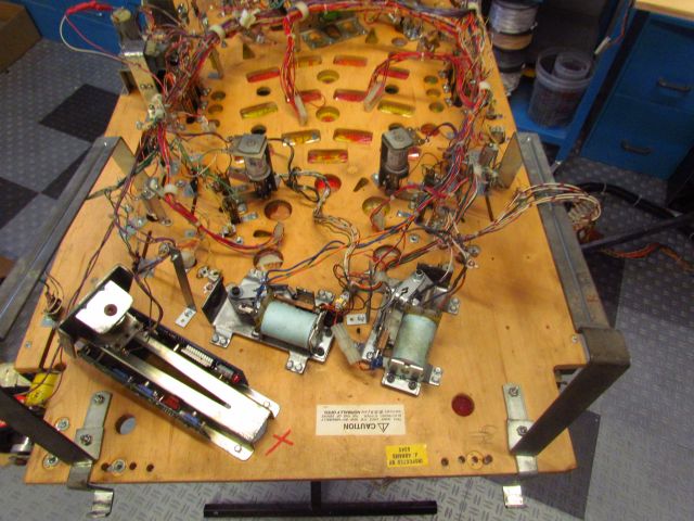 61
Dealing  with the  playfield wiring.It is  pretty poor  overall on this  one because of the  various  hacks as well as the c