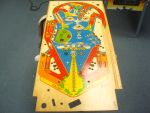 12
 Starting out with a NOS playfield. It is not drilled or dimpled on the topside. 