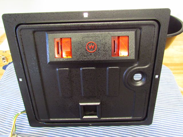 40
Door is assembled with new coin slot plastics.The W logo is highlighted in red to match the  backbone and  speaker panel gri
