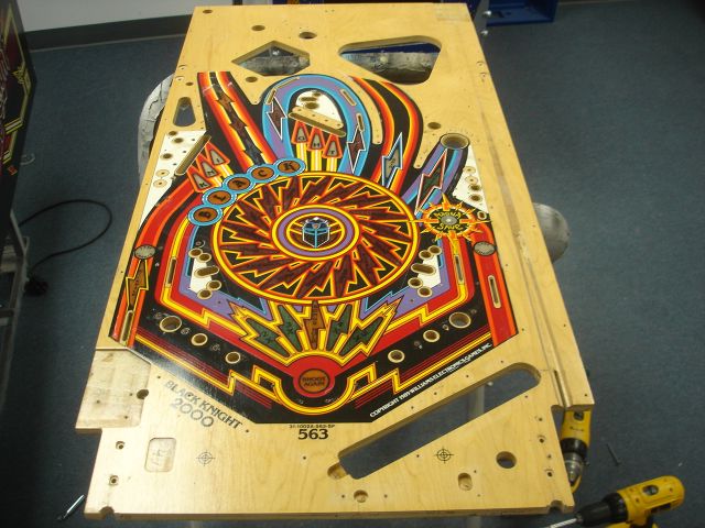 17
 Playfield stripped topside.The hairline cracks from the trough to the shooter lane as well as a small one from the back of 