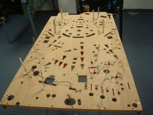 32
 Reassembly of the playfield in process.Steve Ritchie signed the gamee on several locations including the underside of the p