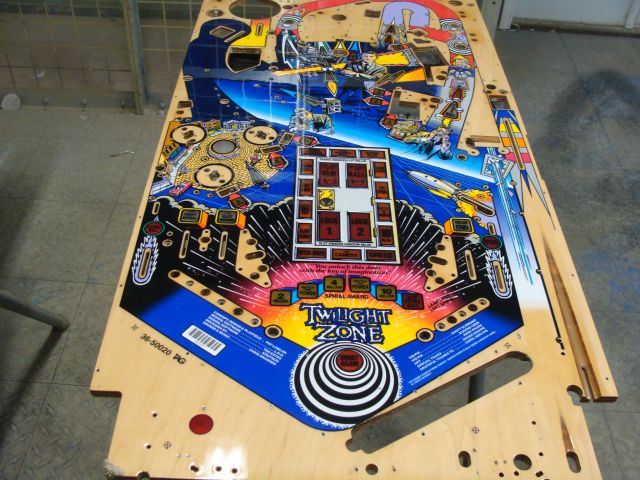 1
 Playfield was previously touched up and cleared by someone else. At a glance it looks okay but further inspection shows ther