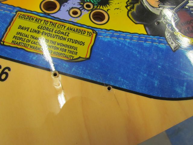 3
There is a lot of raised grain and puckering at screw holes on this playfield.Has likely been in a humid environment at some 