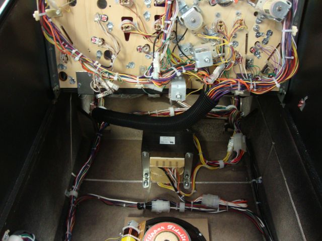 149
 A protective loom tub was added so the wires from the playfield will not catch on anything when it is slid in and out of t