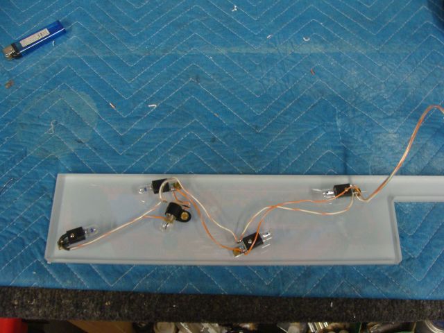 57
 Lighted backboard is wired.The supplied light strip would not work as it is too long and th  panel is made to the cabinet n