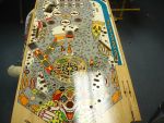 100
 NOS playfield.Much better than a slown out or Mylared  one but still needs a little work.The main thing is the graining.