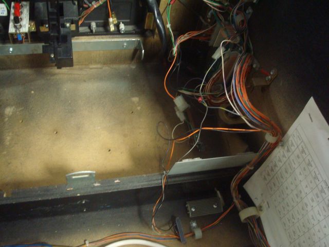 18
 Another byproduct of this  hacked wiring/mod/missing parts thing is there are many more holes in the cabinet and floor beca