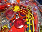 56
LEDs are installed in the jet bumpers.Yellow  post sleeves accent the  wire forms and  playfield colors nicely.