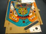 75
 A mid coat of clear has been applied to seal the playfield and further level it.
