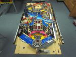 74
Through parts are being installed on the  playfield.